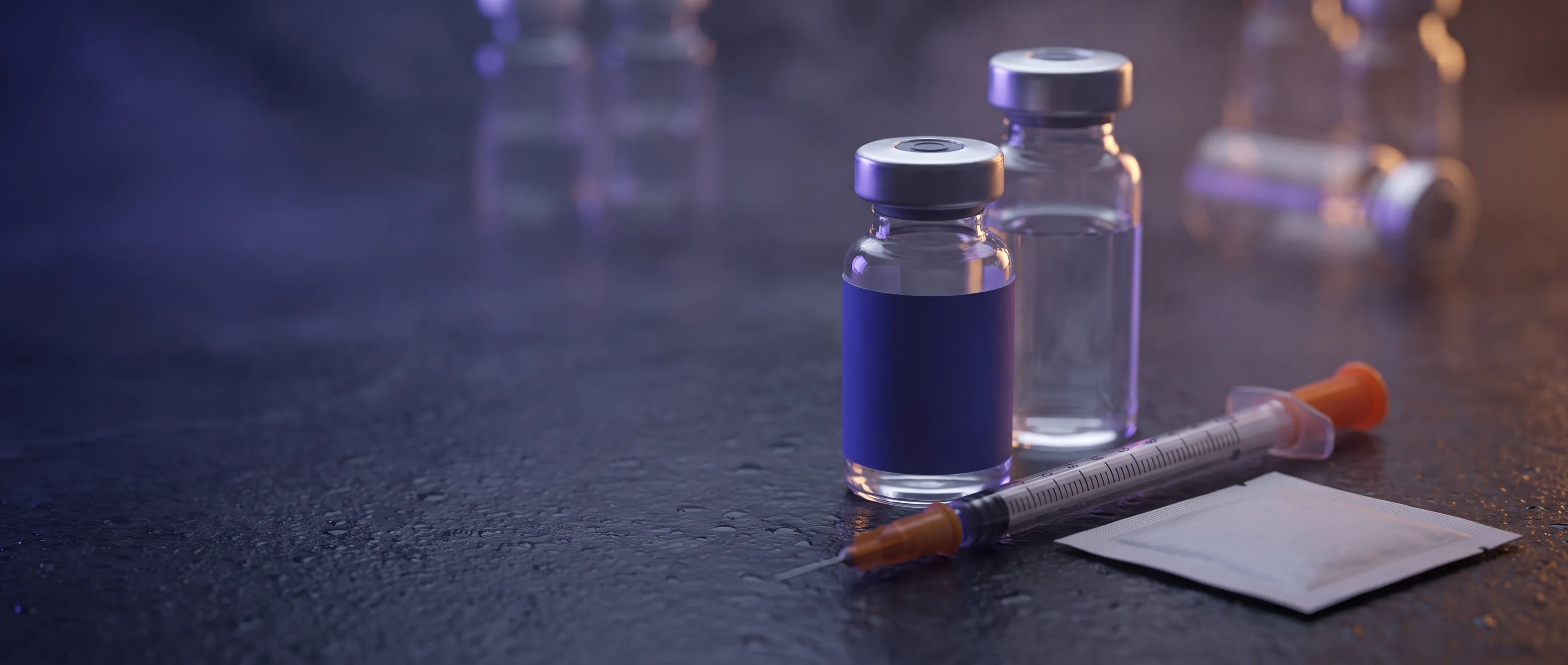 Retatrutide reconstitution kit with an indigo-banded vial, bacteriostatic water, and an insulin syringe on slate.