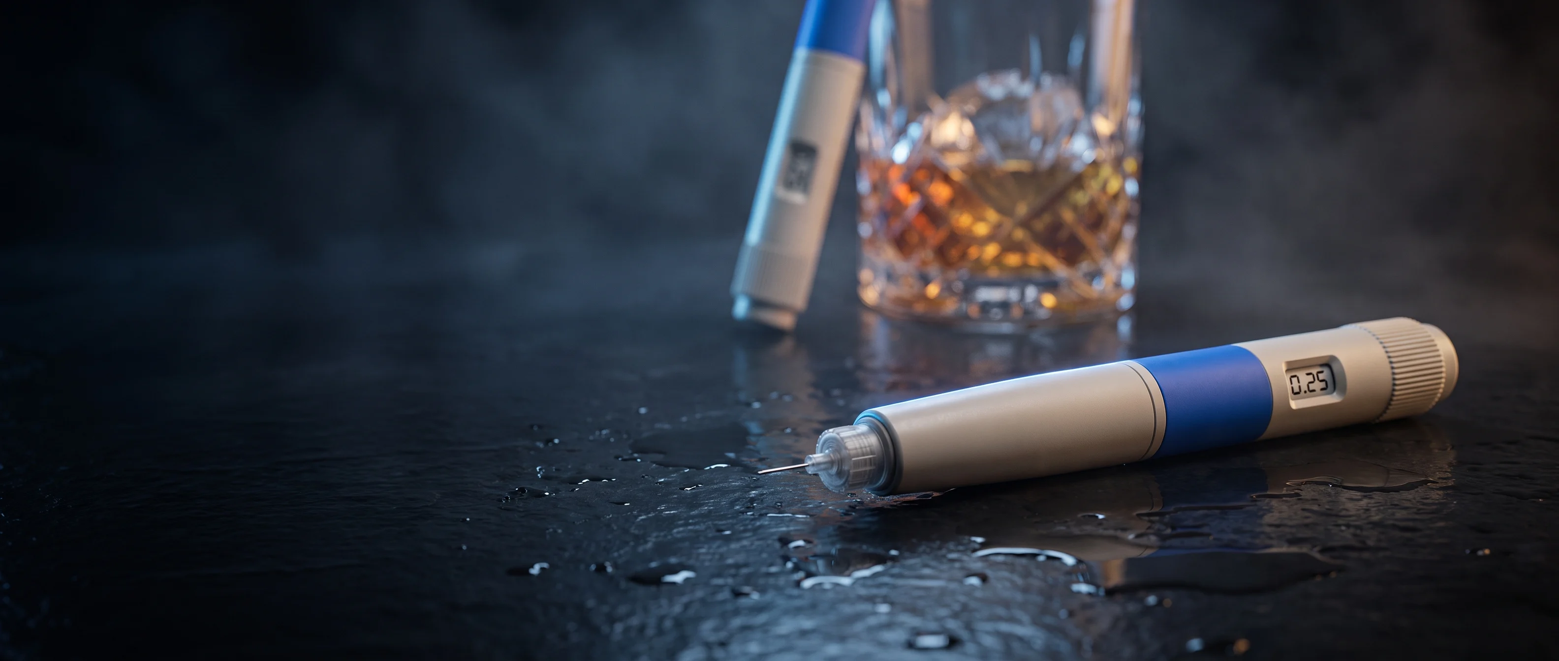 A GLP-1 injection pen on a dark wet surface with an out-of-focus glass of amber liquid behind it.